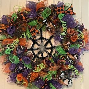 Festive Halloween Wreath with Purple, Green, and Orange Accents